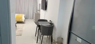 a small room with a table and two chairs at Elite 6 Residence - Sports City by Golden Casa in Dubai