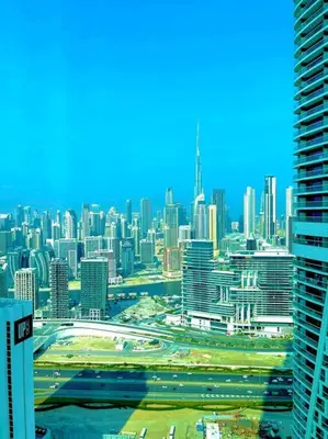a view of a large city with many tall buildings at Best View Security System Burj Kalifa View in Dubai