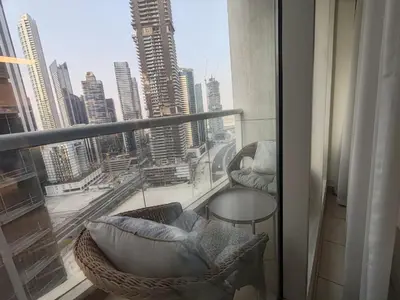 a balcony with a view of a city skyline at Downtown Dubai Mall walk & Burj Khalifa DIFC 5 mins in Dubai