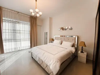 a bedroom with a large bed and a large window at Luxurious & Modern 2BR Plus Maid, Sparkle Tower Dubai Marina - 10AB4 in Dubai