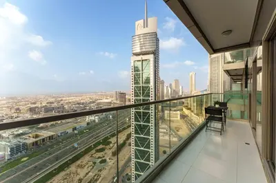 a balcony with a view of a city at Experience Opulent Living at Paramount Midtown in Dubai
