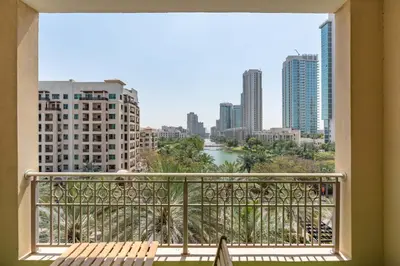 a balcony with a view of a river and buildings at Lux BnB I Una Tower I Lakes View in Dubai