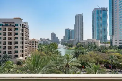 a view of a river in a city with tall buildings at Lux BnB I Una Tower I Lakes View in Dubai