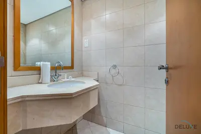 a bathroom with a sink and a mirror at Sophisticated 3BR w/ Assistant’s Room at Al Fattan Marine Towers 2 JBR by Deluxe Holiday Homes in Dubai
