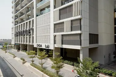 an apartment building with a sign on the side of it at Pool View One Bed Room Business Bay in Dubai