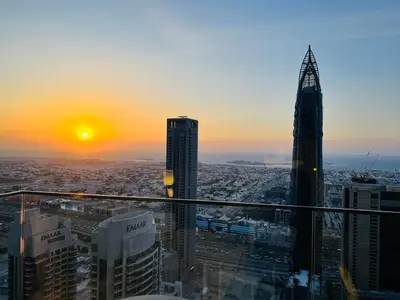 a view of a city at sunset from a skyscraper at The Address Residences Dubai Opera in Dubai