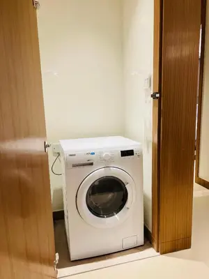 a washer and dryer in a small room at The Address Residences Dubai Opera in Dubai