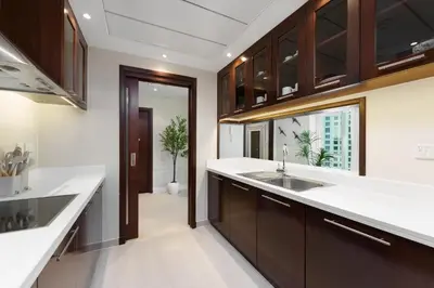 a kitchen with a sink and a window at Maison Privee - Modern Beach Living in the Heart of Dubai Marina in Dubai