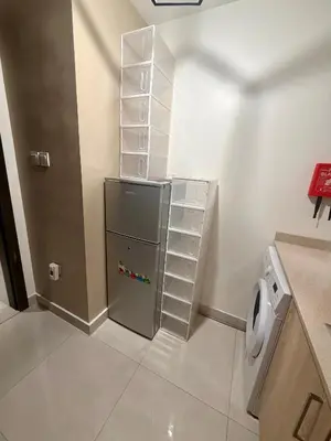 a bathroom with a refrigerator and a toilet at Cozy Spacious AG Tower Business Bay, Dubai in Dubai