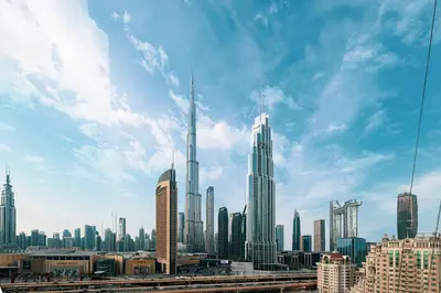 a view of a large city with skyscrapers at Burj Khalifa View, 2 Balcony w Lounge, Dubai Mall Access, Gym, Infinity-Pool, Playground, BBQ, Family Friendly in Dubai