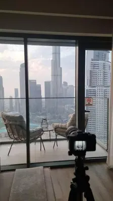 a camera in a room with a view of a city at Mesmerizing view of Burj Khalifa in Dubai