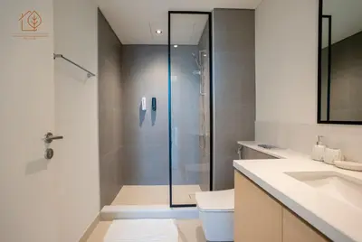 a bathroom with a shower and a toilet and a sink at 3 Bedroom Family Apartment from High Floor Downtown Views 183BC-3 in Dubai