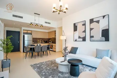 a living room with a couch and a table at 3 Bedroom Family Apartment from High Floor Downtown Views 183BC-3 in Dubai