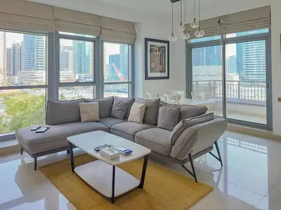 a living room with a couch and a table at Spacious 1-Bed Apartment Next to Dubai Mall 157CL2-1 in Dubai