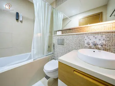 a bathroom with a sink and a toilet and a shower at Spacious 1-Bed Apartment Next to Dubai Mall 157CL2-1 in Dubai
