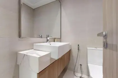 a bathroom with a white sink and a mirror at Azizi Riviera 16 - Charming Studio in Dubai