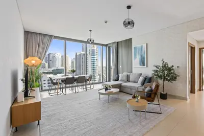 a living room with a couch and a table at 5242 Tower 2 - Chic Two Bedroom in Dubai
