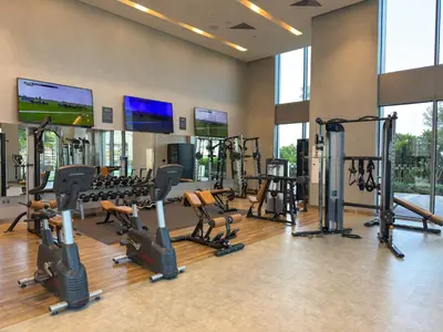 a gym with treadmills and ellipticals in a building at 5242 Tower 2 - Chic Two Bedroom in Dubai