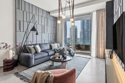 a living room with a couch and a table at The Smart Concierge - Stella Maris in Dubai