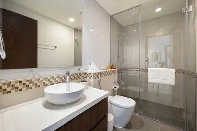 a bathroom with a sink and a toilet and a shower at Modern Two Bedroom Apartment with Private Balcony By HSHOME - Downtown Dubai in Dubai