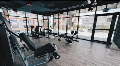 a gym with a bunch of treadmills and machines at Luxury 1bedrom Binghatti Avenue in Dubai