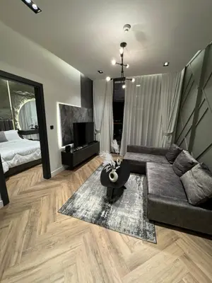 a living room with a couch and a bed at Luxury 1bedrom Binghatti Avenue in Dubai