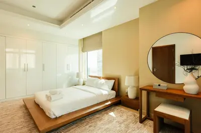 a bedroom with a large bed and a mirror at Stunning 2BR with Captivating Marina View - 17AB06 in Dubai