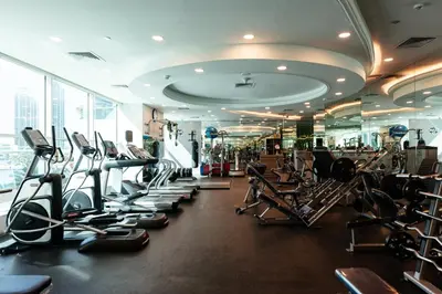 a gym with lots of treadmills and elliptical machines at Stunning 2BR with Captivating Marina View - 17AB06 in Dubai