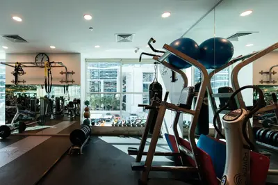 a gym with a bunch of equipment in a room at Stunning 2BR with Captivating Marina View - 17AB06 in Dubai