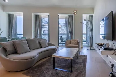 a living room with a couch and a table at 2BDR apartment near Burj Khalifa I Downtown Dubai I Burj Vista in Dubai