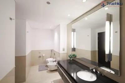 a bathroom with a sink and a toilet at Luxury Marina View Apartment in JW Marriott Residences in Dubai