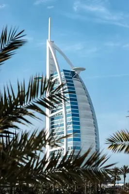 a building with a palm tree in front of it at Vacay Lettings 2 Bed Retreat near Burj Al Arab in Dubai