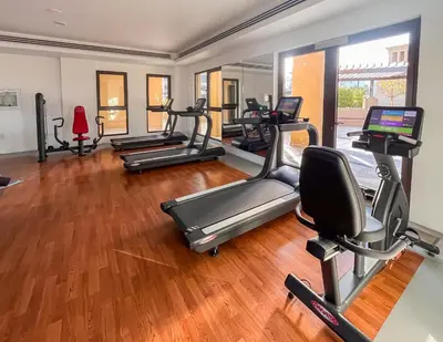 a gym with several treadmills and exercise bikes at Vacay Lettings 2 Bed Retreat near Burj Al Arab in Dubai