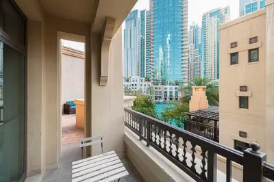 a balcony with a view of a city at Old Town Luxury: 1-BR Apartment with Large Terrace & Burj Khalifa View in Dubai