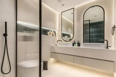 a bathroom with two sinks and a mirror at Fully Furnished 4 BR in Dubai Marina - Very close to Metro in Dubai