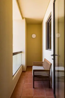 a room with a table and a chair in it at JBR Full Sea View Apartment 1 BR in Dubai