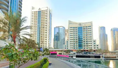 a city skyline with tall buildings and a bridge at Spontaneous Sea View and High floor Studio Apartment in Dubai