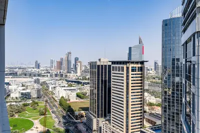 an aerial view of a city with tall buildings at Spacious apartment with Maid room in Dubai Marina I Marina Arcade in Dubai