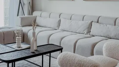 a living room with a white couch and a table at Burj Crown Luxury 2bedroom Balcony & View in Dubai
