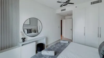 a bedroom with a fireplace and a mirror at Burj Crown Luxurious 2Bedroom Balcony in Dubai