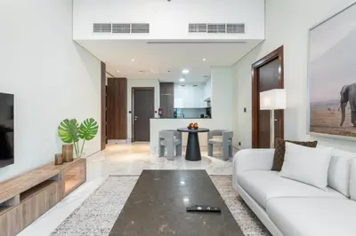 a living room with a couch and a table at Vacay Lettings 1 bed Business home in J One Tower Business bay in Dubai