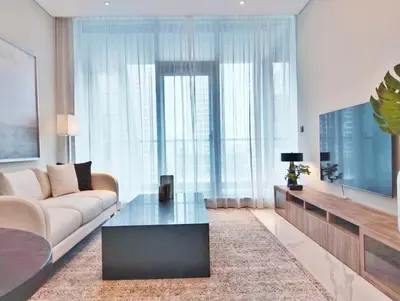 a living room with a couch and a coffee table at Vacay Lettings 1 bed Business home in J One Tower Business bay in Dubai