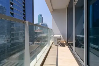 a balcony of a building with a view of the city at Naseem - Studio One Tower in Dubai