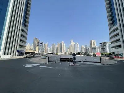 a parking lot with a view of a city at Spacious Jlt High Floor Studio Wstunning Views in Dubai