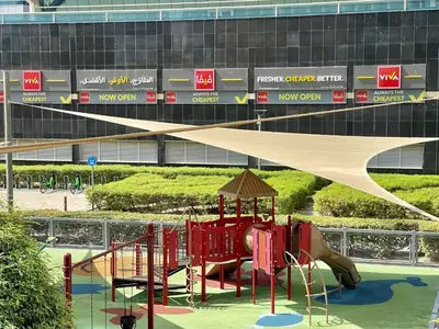 a playground with a slide in front of a building at Spacious Jlt High Floor Studio Wstunning Views in Dubai