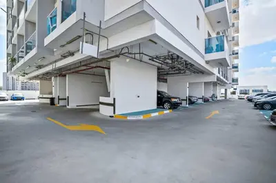 a parking lot of a building with cars parked at Newly Built Studio - Comfort in Dubai