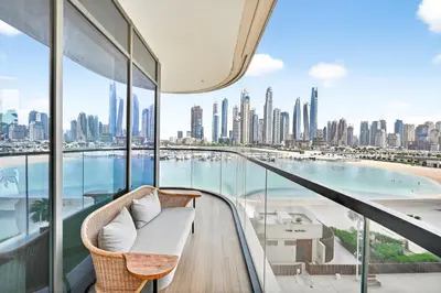 a balcony with a view of the city at Seascape Sanctuary - 3 and a Half BR Beachfront Bliss - Marina Vista Tower 1 in Dubai