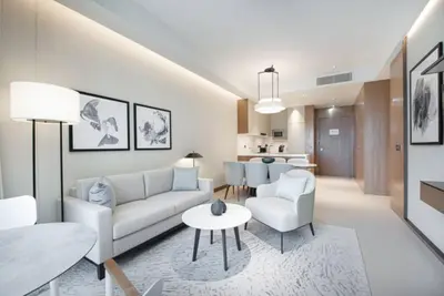 a living room with a couch and a table at Luxurious stay in Downtown Dubai in Dubai