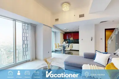a living room with a couch and a table at Cayan Tower - Smart One Bedroom Loft on High Floor in Dubai