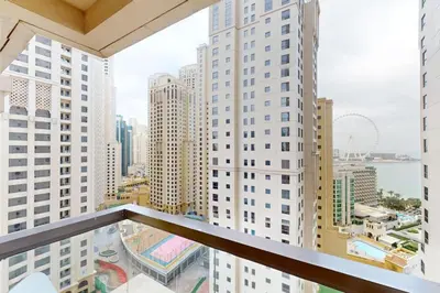 a view of a city from a balcony of a building at Vacationer I Premium 1 Bed I Steps to JBR Beach & Nightlife I Bahar 6 Tower in Dubai